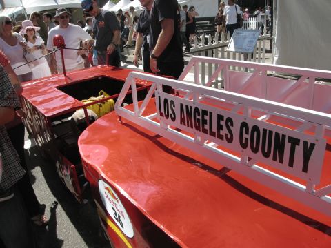 1986 Ford Bronco - A custom-built Red Bull Soap Box Derby vehicle with "Los Angeles County" signage is displayed outdoors.