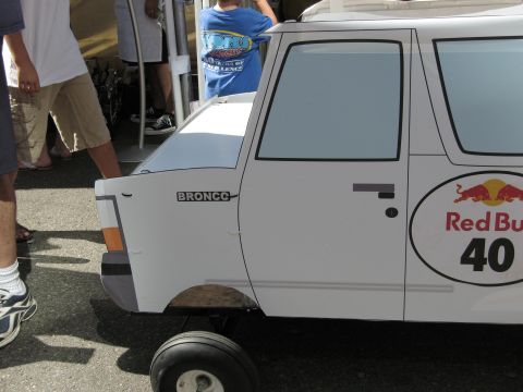 1986 Ford Bronco - A custom-built soap box car designed to resemble a vehicle, complete with branding and a model name.