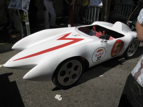 1986 Ford Bronco - This custom race car, possibly a soapbox derby vehicle, features a distinctive white body with red racing stripes and prominent Red Bull br…