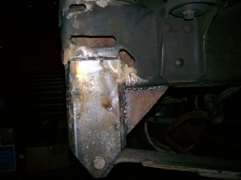 1989 Ford Bronco - Close-up view of a custom welded frame modification, a bolt head marked '601'.