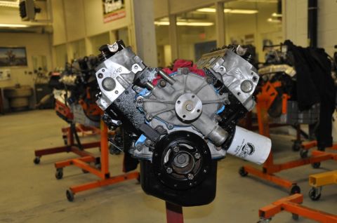 1996 Ford Bronco - Engine on a stand in a workshop, with other engines visible in the background.