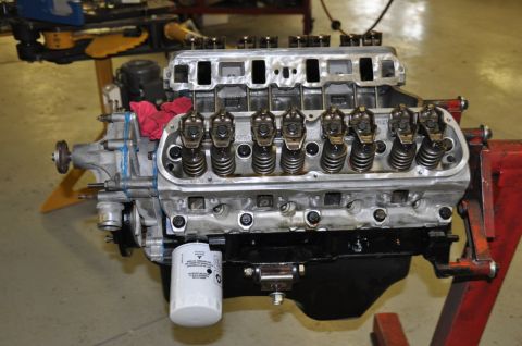 1996 Ford Bronco - Engine assembly on a stand, with internal components exposed for inspection.