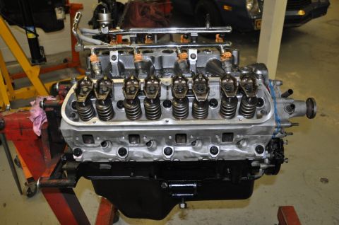 1996 Ford Bronco - Engine assembly on a stand, its valve train and fuel injection system.