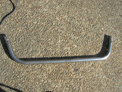 1996 Ford Bronco - A metal bar with a curved shape is shown on a gravel ground.