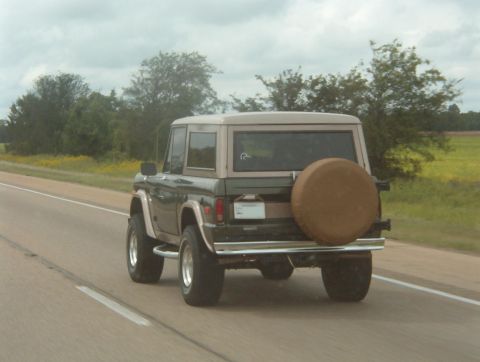 1975 Ford Bronco - This 1975 Ford Bronco is seen from the rear while driving on a highway.