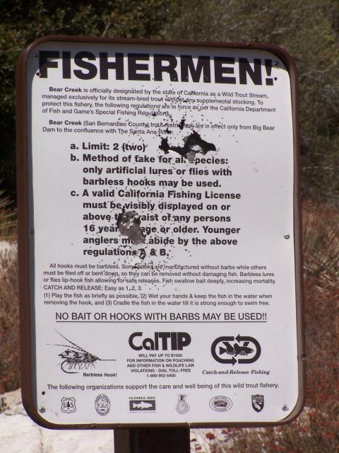 1990 Ford Bronco - This sign details the fishing regulations for Bear Creek, emphasizing barbless hooks and catch-and-release practices.
