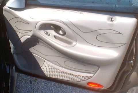 1999 Ford Taurus - Interior door panel custom flame graphics and a mesh pocket.