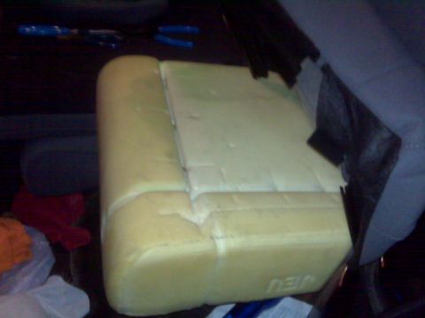 2008 Jeep Wrangler - Car seat foam padding is visible, with tools scattered in the background.