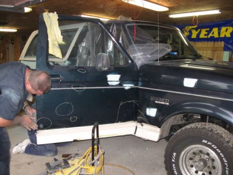 1992 Ford Bronco - my dad checking the dents out on the door