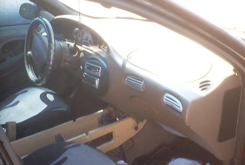 1999 Ford Taurus - Interior view of a 1999 Ford Taurus, focusing on the dashboard and driver's area.