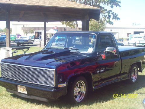 1995 Ford Probe - This pickup truck has a custom paint job with flames and aftermarket modifications.