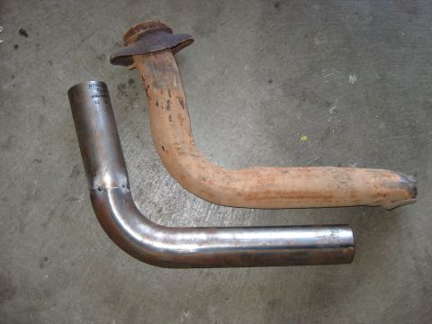 1995 Ford Bronco - A comparison of a new exhaust pipe next to an old, corroded one.