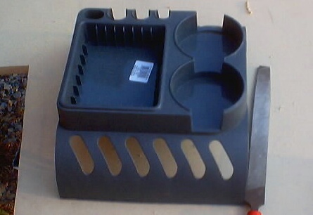 1999 Ford Taurus - This organizer tray has multiple compartments and cup holders for car interior use.