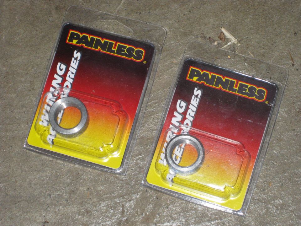 Two packages of Painless Wiring Accessories with metal rings