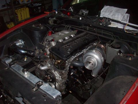 1992 Nissan 240SX - Engine bay view showing a turbocharged setup with aftermarket components and visible wiring.