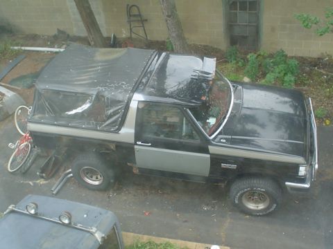 1988 Ford Bronco - This 1988 Ford Bronco has a black soft top and a two-tone paint scheme.