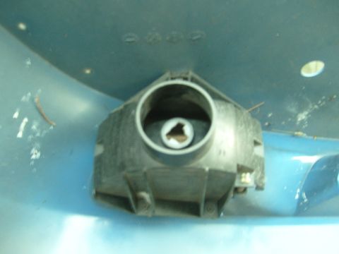 1992 Ford Bronco - This is a close-up view of a vehicle's headlight housing, showing the internal mounting points.
