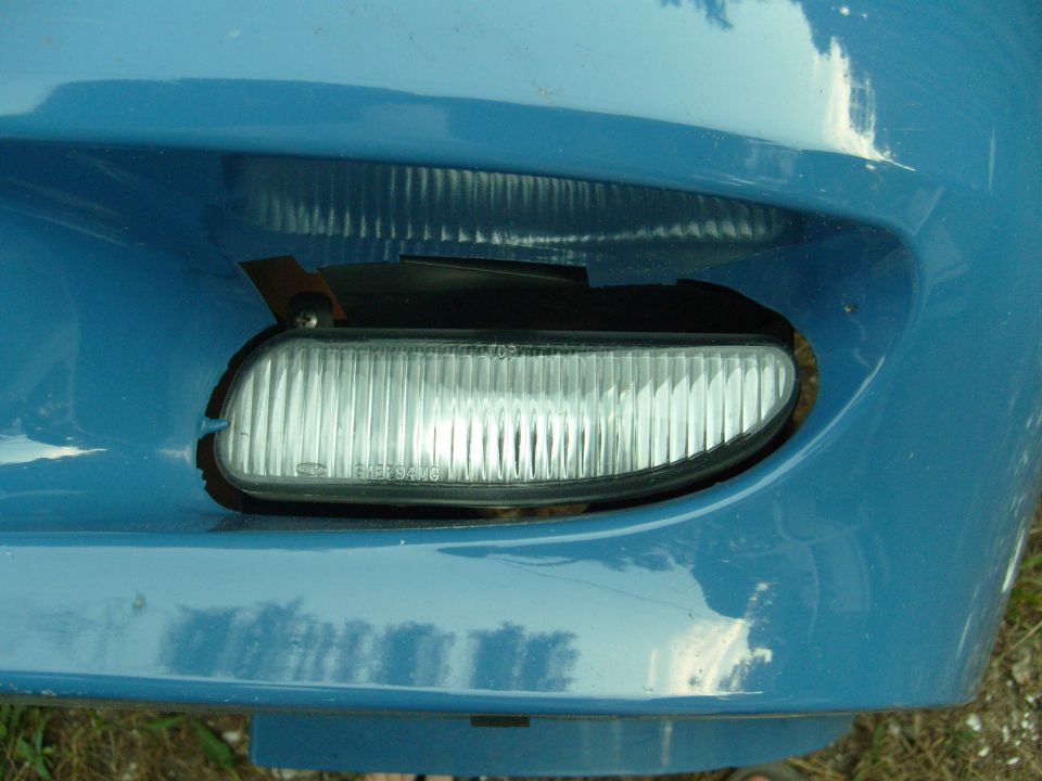 Blue vehicle front bumper fog light detail