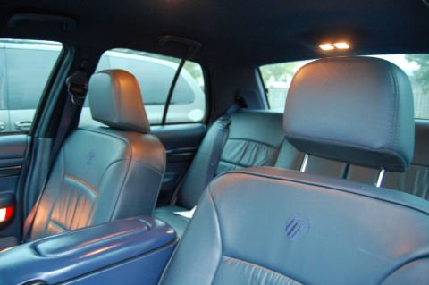 1985 Mercury Grand Marquis - Interior view of a 1985 Mercury Grand Marquis, highlighting the blue leather seats and headrests.