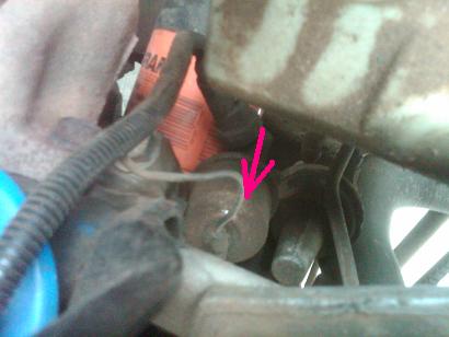 1982 Ford Bronco - A pink arrow highlights a specific engine part in this close-up view.