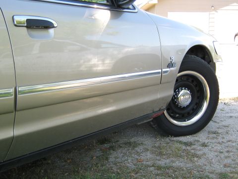 2000 Mercury Grand Marquis - A 2000 Mercury Grand Marquis is shown from the side, a 4.6 badge on the fender.