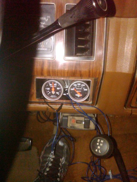 1982 Ford Bronco - Interior shot showing gauges and a 4-wheel drive selector knob.