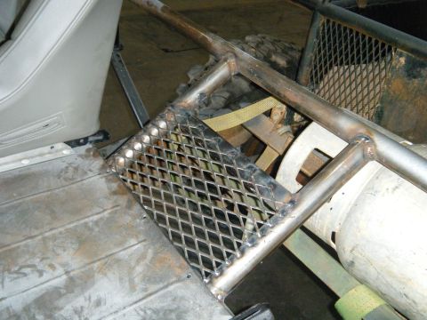 1978 Ford Bronco - Custom roll cage and diamond plate step installed in the interior of a vehicle.