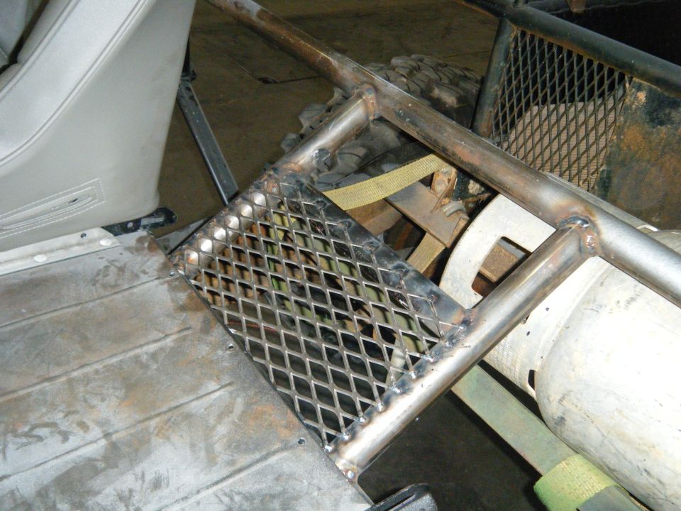 Diamond plate step and roll cage inside a vehicle interior