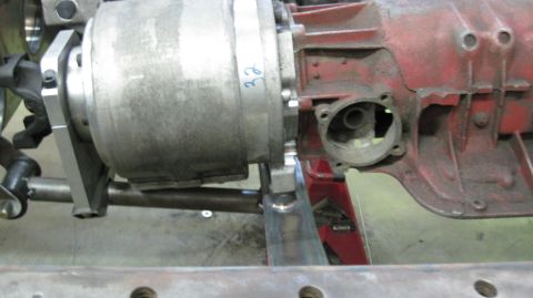 1995 Ford Bronco - Close-up view of vehicle transmission and suspension parts, with visible metal framing and components.