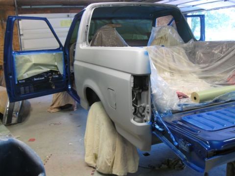 1992 Ford Bronco - This 1992 Ford Bronco is being prepped for paint with doors open and interior covered.