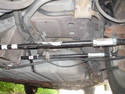 1999 Ford Taurus - Adjustable control arms installed on the rear suspension of a vehicle.