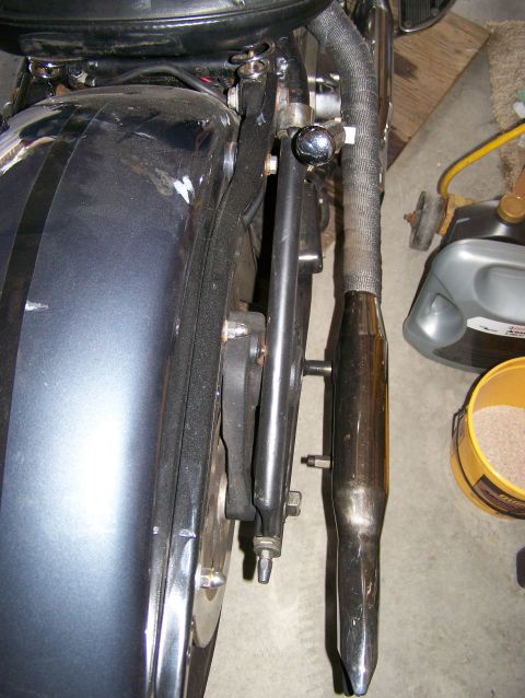 1988 Suzuki Samurai - Close-up view of a motorcycle's rear fender and exhaust system.