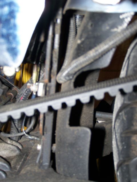 1988 Suzuki Samurai - A close-up view of the engine's belt system, showing the belt, pulleys, and surrounding components.