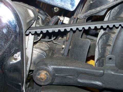 1988 Suzuki Samurai - Close-up of a motorcycle's belt drive system and engine parts.