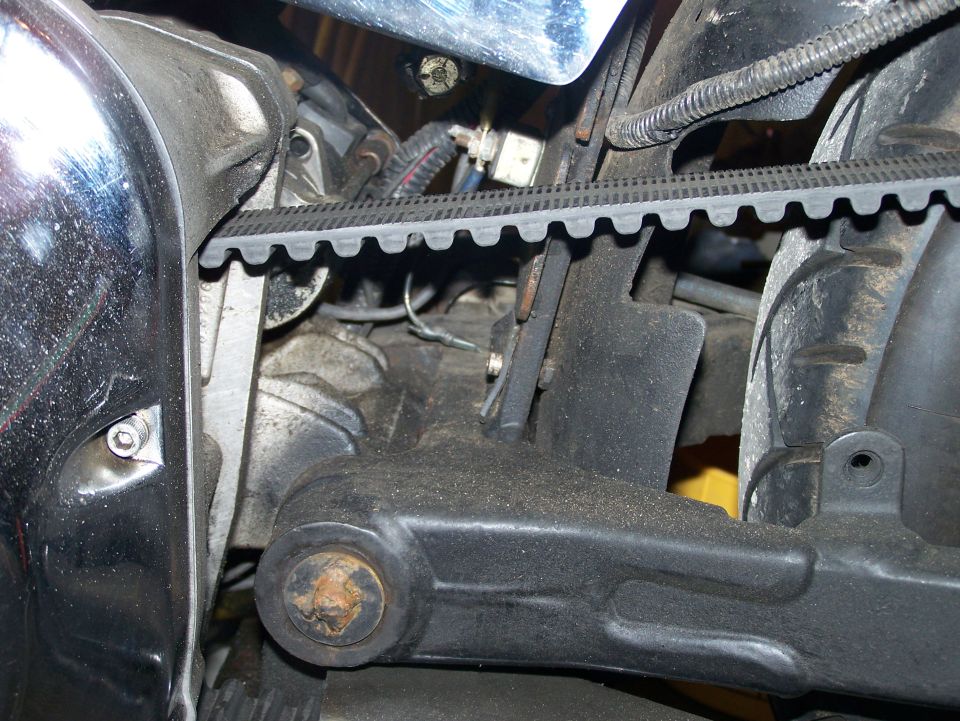 Motorcycle belt drive and engine components, close-up view