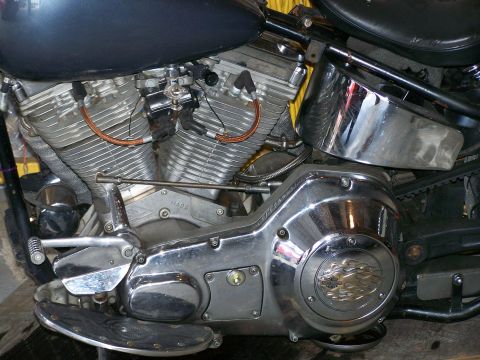 1988 Suzuki Samurai - Detailed view of a V-twin motorcycle engine, showing chrome components and a black fuel tank.