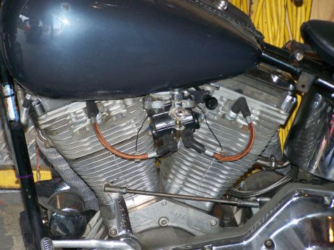 1988 Suzuki Samurai - The V-twin engine features prominent fins and copper spark plug wires connecting to the ignition system.