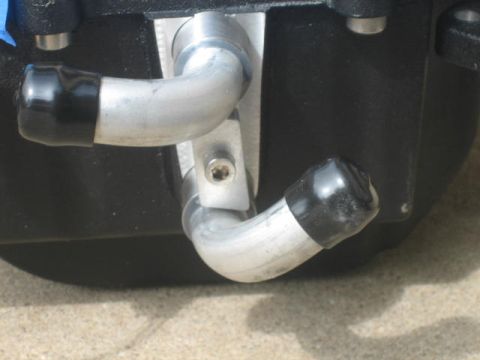 1996 Ford Thunderbird - This image shows a close-up of an automotive part with two metal hoses.