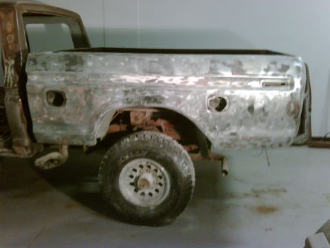 1979 Ford F-250 - This 1979 Ford F-250 crewcab shows its bare metal bed and fender, likely undergoing restoration.