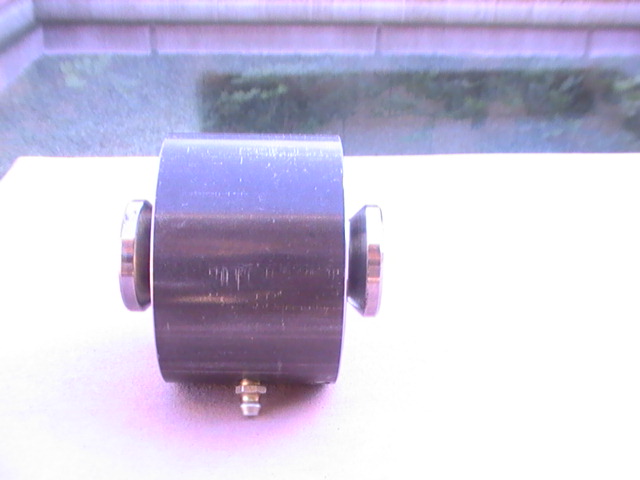 metal cylinder with silver ends and a small bolt on the bottom