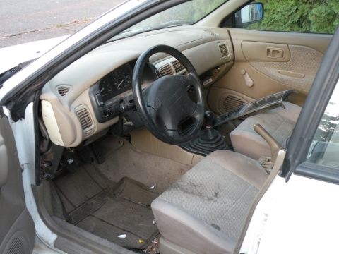 1998 Subaru Legacy - Interior view of a 1998 Subaru Legacy, showing the dashboard, steering wheel, and seats.