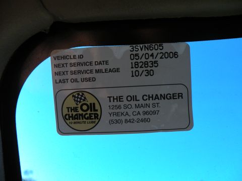 1998 Subaru Legacy - This sticker shows the vehicle's last oil change details and the service provider's information.