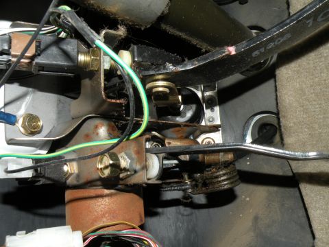 1998 Subaru Legacy - Under-dash view of mechanical linkages and wiring harness components.