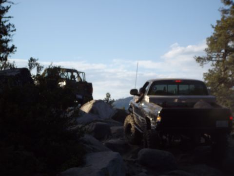 1982 Toyota 4Runner - Two vehicles traverse a challenging rocky path, highlighting their off-road capabilities.