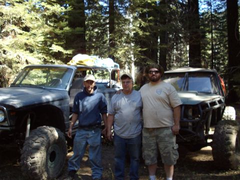 1982 Toyota 4Runner - Three men pose with two off-road vehicles in a wooded area.