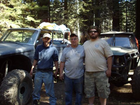 1982 Toyota 4Runner - Three men pose with their off-road vehicles in a forest setting.