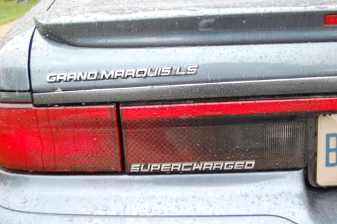 1985 Mercury Grand Marquis - This Grand Marquis LS features a 'Supercharged' badge on its rear, indicating a modified or performance-oriented model.