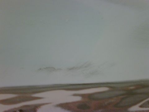 1979 Ford F-250 - Faint marks are visible on a light-colored car body panel.