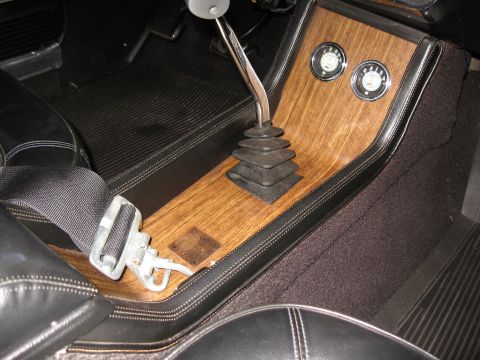 1968 Shelby GT500 - Interior console of a 1968 Shelby GT500, wood grain trim and a floor shifter.