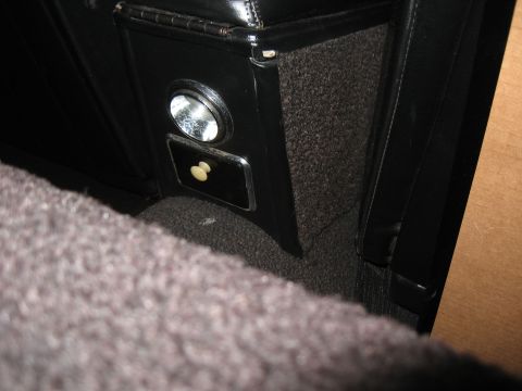 1968 Shelby GT500 - Close-up of a car's interior console, including an ashtray and lighter mechanism.